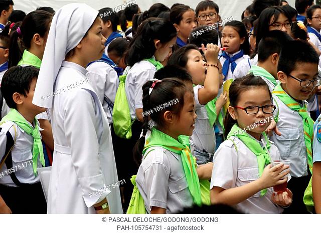 Church of the Sacred Heart of Jesus ( Nha Tho Tan Dinh ). Children at catholic sunday school. Ho Chi Minh City. Vietnam. | usage worldwide