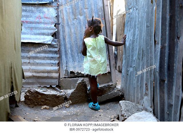 Girl, two years, standing in the doorway of a shack, Camp Icare for earthquake refugees, Fort National, Port-au-Prince, Haiti