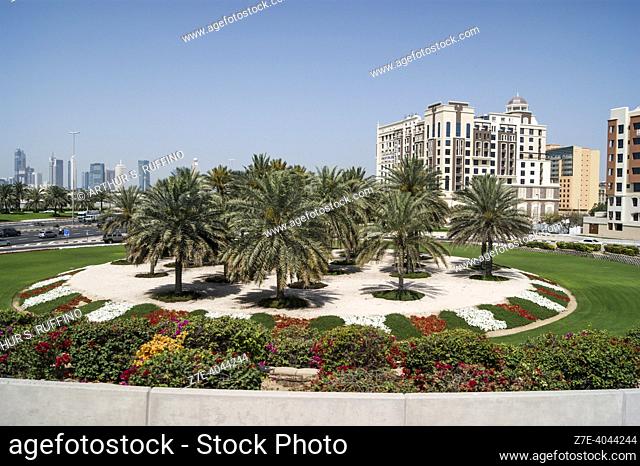Rotary (roundabout) with flower bed. The roads and highways of Dubai. Traffic flow. cityscape. Dubai. United Arab Emirates. Middle East