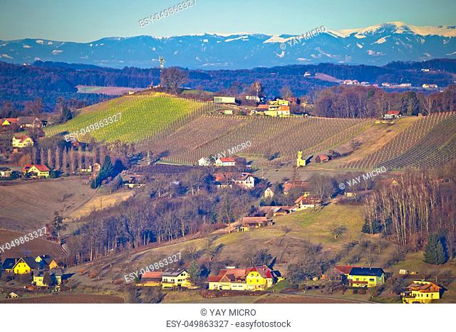 Countryside landscape of Styria region with mountain under snow in background, Austria