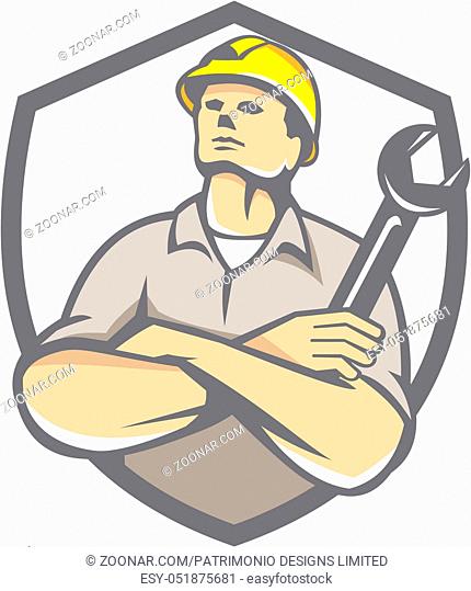 Illustration of a builder construction worker arms crossed holding wrench looking up set inside shield crest on isolated background done in retro style