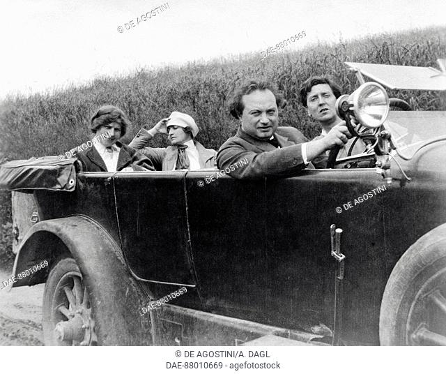 Helene Berg, Alma Mahler, Franz Werfel (1890-1945) and Alban Berg (1885-1935) photographed in a car.  Vienna, Alban Berg Stiftung