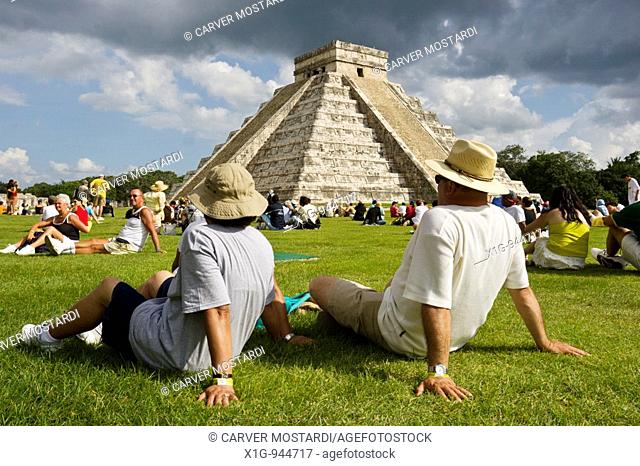 Tourists viewing El Castillo Pyramid of Kukulcan 'The Castle' during the fall equinox at the Mayan site of Chichen Itza, Mexico