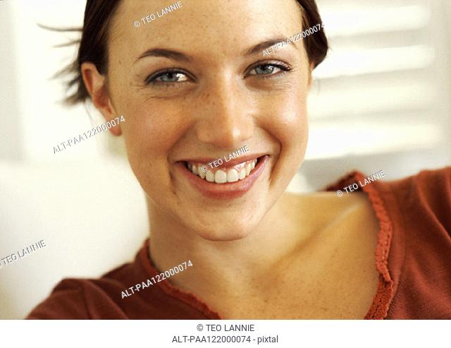 Woman smiling, close-up, portrait