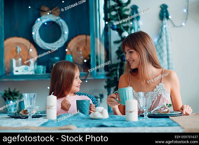 Mother and little daughter child girl at home
