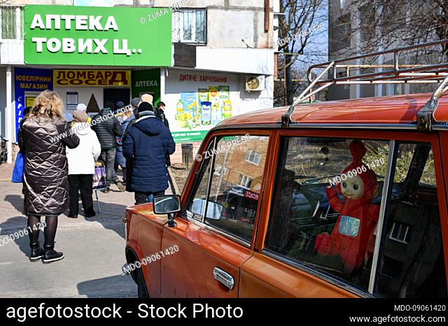 February 24, 2022, Kramatorsk, Donetsk, Ukraine: People wait in a line outside a pharmacy in the center of Kramatorsk. .US President Joe Biden announced new...
