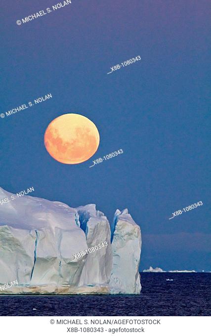 Full moon plus 1 day rising over icebergs in the Weddell Sea, Antarctica  MORE INFO This moonrise occurred on January 1, 2010