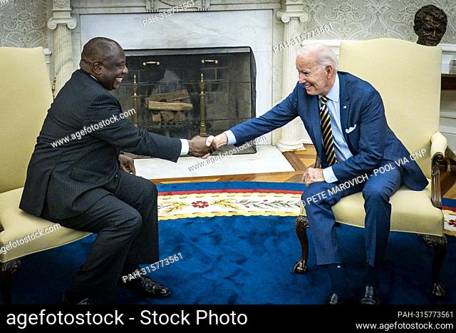 United States President Joe Biden shakes hands with President Cyril Ramaphosa of South Africa during a bilateral meeting in the Oval Office of the White House...