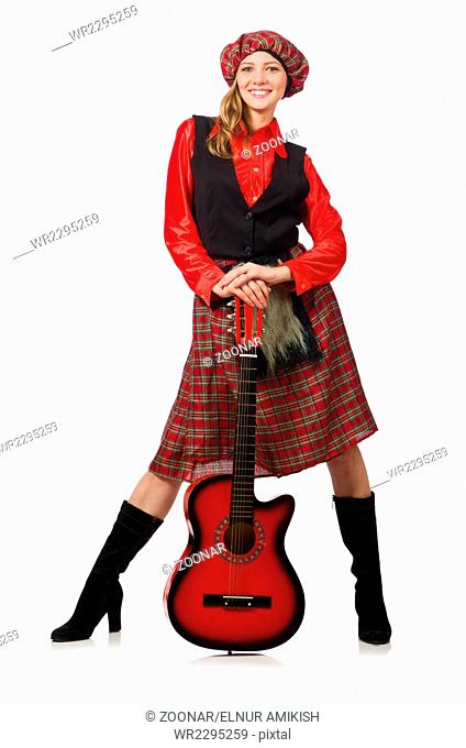 Funny woman in scottish clothing with guitar
