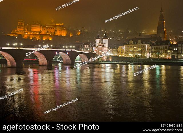 Heidelberg, Snowy night city view by the river Rhein, Karl Theodor Bridge, Germany, Europe