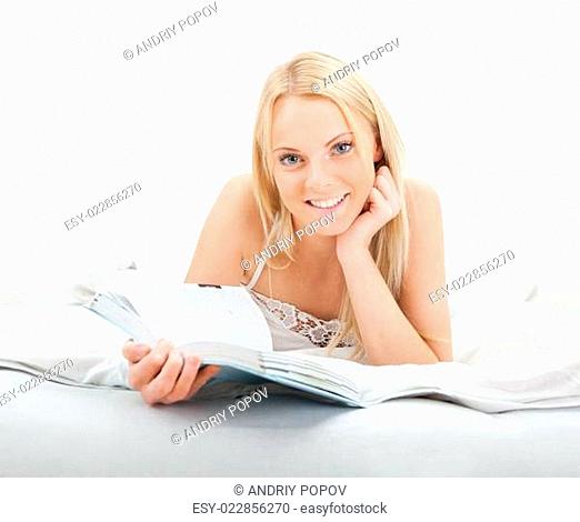 Young beautiful woman reading book