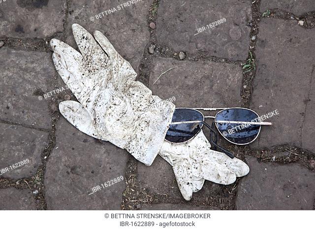 Love Parade 2010, disposable gloves used by emergency physicians and sunglasses in the underpass where many people died in a stampede, Duisburg, Ruhr Area