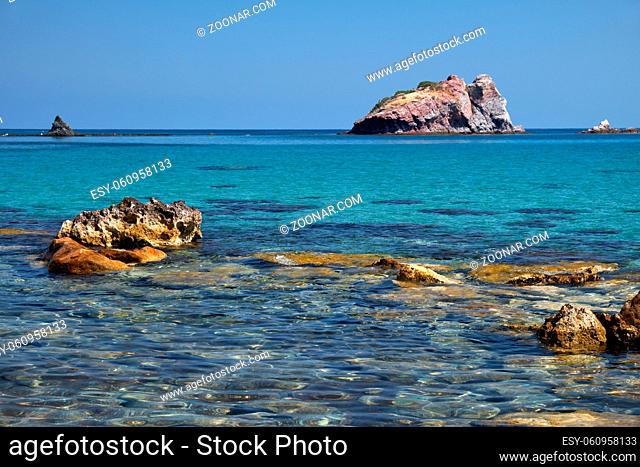 The view of the blue Takkas bay with large volcanic rock of Aphrodite near Baths of Aphrodite on the Akamas Peninsula. Cyprus