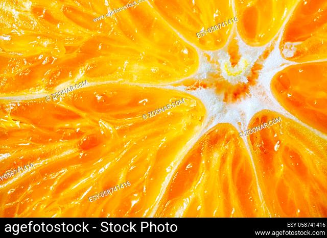 Macro orange background. Ripe, juicy citrus close-up