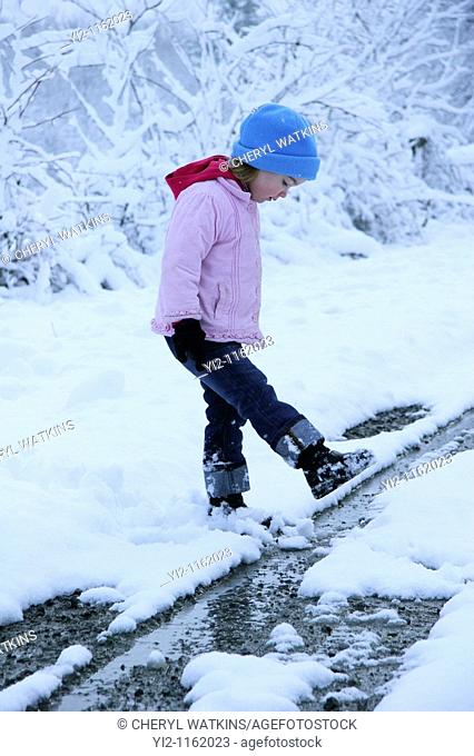 A girl walking in snow
