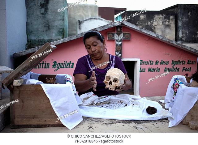 A woman cleans the bones of a deceased family member in the Mayan village of Pomuch, Hecelchakan, Campeche, Yucatán península, October 30, 2016