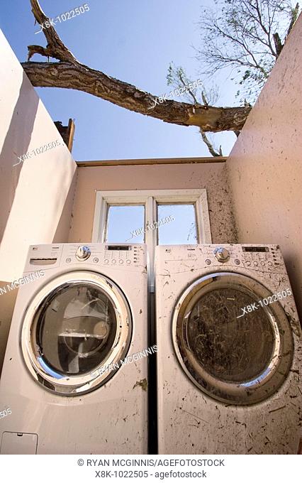 Thow washing machines in the destroyed bathroom/laundry room in the home of Rob and Laurel Marlatt, 1004 South Highway 14, south of Aurora