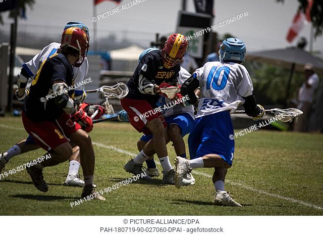 Players battle for the ball during the 2018 World Lacrosse Championship 29th to 32nd place match between Argentina and Spain at the Orde Wingate Institute for...