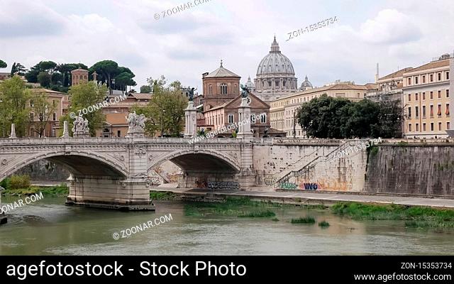 ROME, ITALY- SEPTEMBER, 5, 2016: shot of st peter's basilica and the tiber river in rome, italy