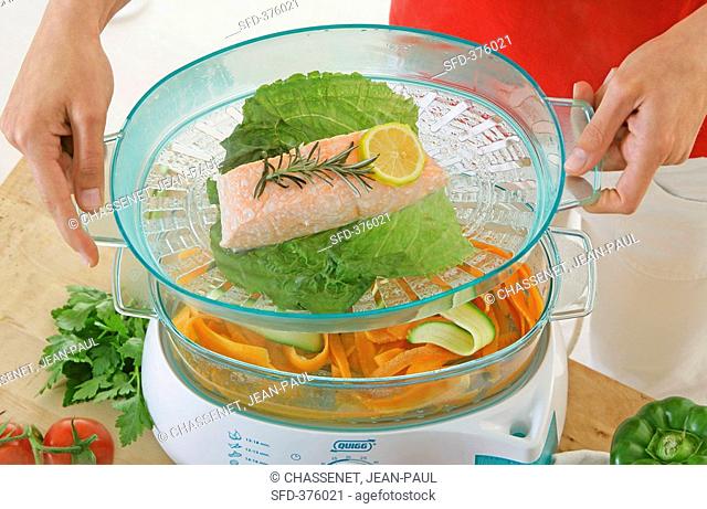 Fish and vegetables in a steamer