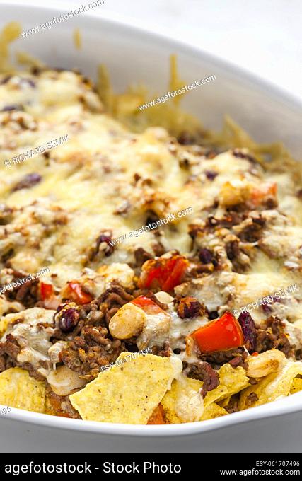 nachos with minced beef , red pepper and beans