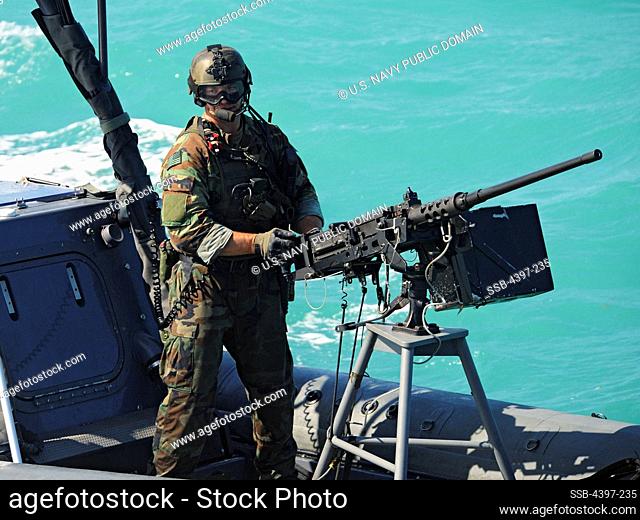 Special Warfare Combatant-Craft Crewman Mans a Machine Gun