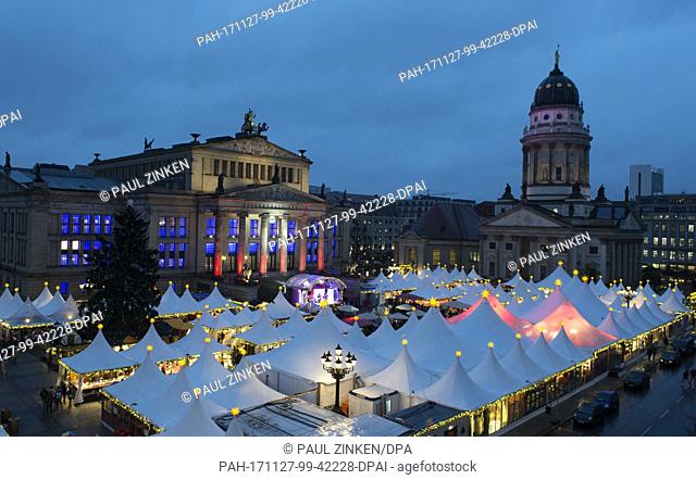 The Gendarmenmarkt Christmas market glows with light in Berlin, Germany, 27 November 2017. The Christmas market in front of the the Konzerthaus in Berlin opened...