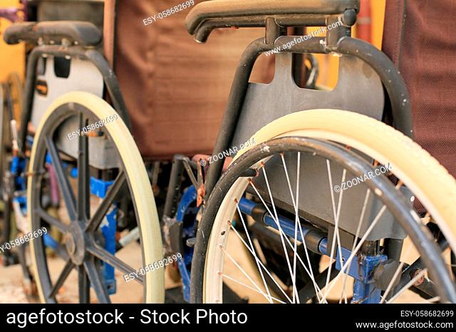 Bunch of empty wheelchairs parked in hospital