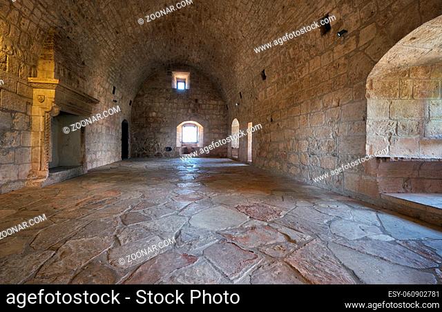 KOLOSSI, CYPRUS - JUNE 12, 2018: Interior of the room with fireplace that were used for accomodation on the second storey of Kolossi Castle. Kolossi