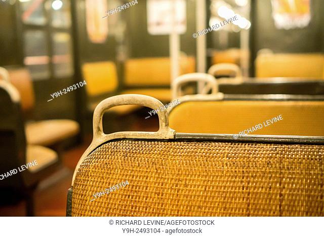 Iconic rattan seats and handholds on a BMT D-Type Triplex train, in use from 1927-1965, as it travels from the NY Transit Museum on a short run to...