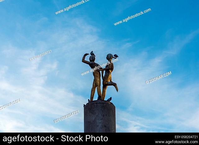A statue on Hermannplatz in Berlin Neukoelln with blue sky