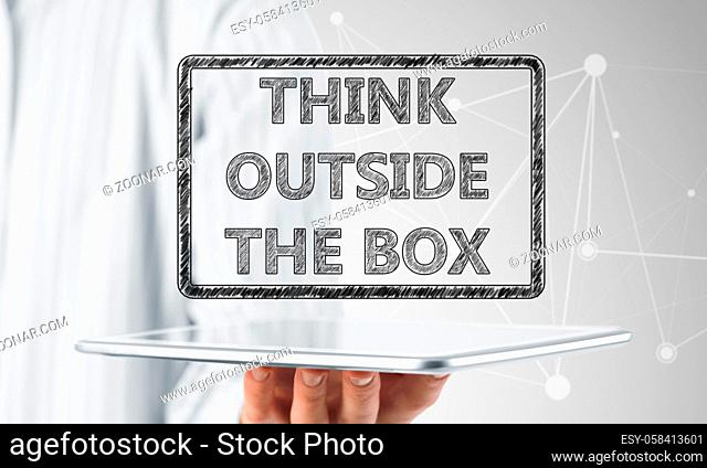 Hand of businessman holding tablet pc with creativity concept