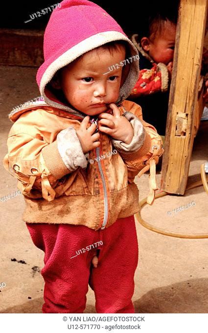 little boy of the Mosuo Minotity near the Lugu Lake. Yunnan. China
