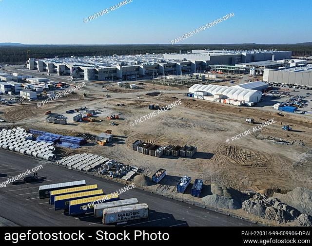 PRODUCTION - 11 March 2022, Brandenburg, Grünheide: The construction site of the Tesla Gigafactory Berlin Brandenburg (aerial view with a drone)