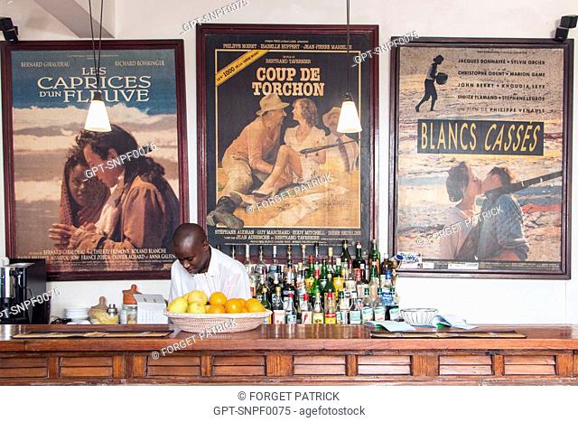 BAR OF THE RESTAURANT HOTEL DE LA RESIDENCE WITH POSTERS OF FILMS SHOT IN THE REGION, SAINT-LOUIS-DU-SENEGAL, SENEGAL, WEST AFRICA