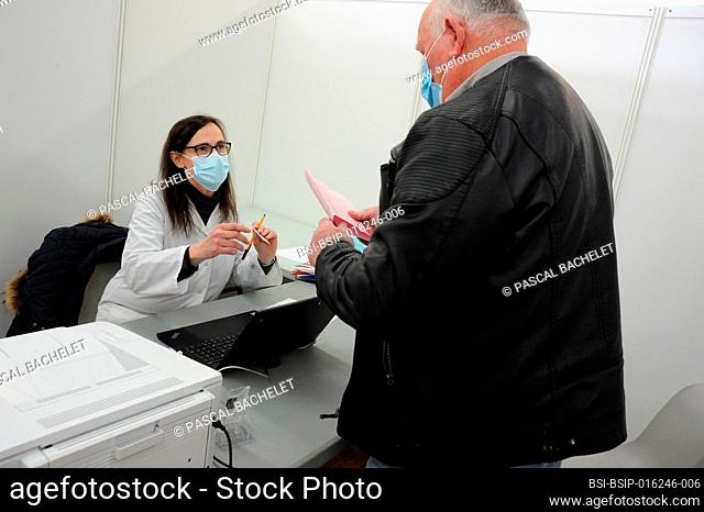 Medical consultation of the patient before injection of the Covid-19 vaccine in a vaccination center. Covid 19 vaccination center in Abbeville (80)