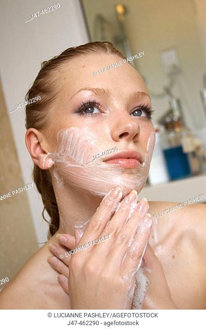 21 year old girl in the bath washing her face