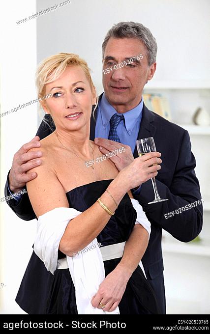 Formal couple drinking champagne