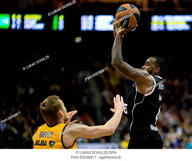 Berlin's Niels Giffey (l) and Madrid's K.C. Rivers (r) vie for the ball during the Basketball Euroleague group B match Alba Berlin vs Real Madrid at the O2...
