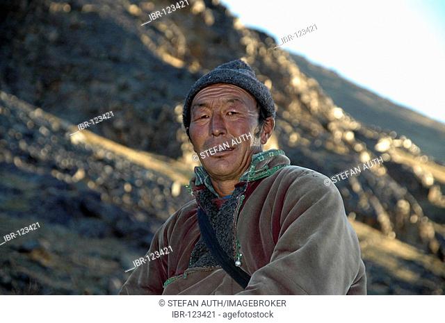 Nomads man covered in a traditonal coat Kharkhiraa Mongolian Altai near Ulaangom Uvs Aymag Mongolia