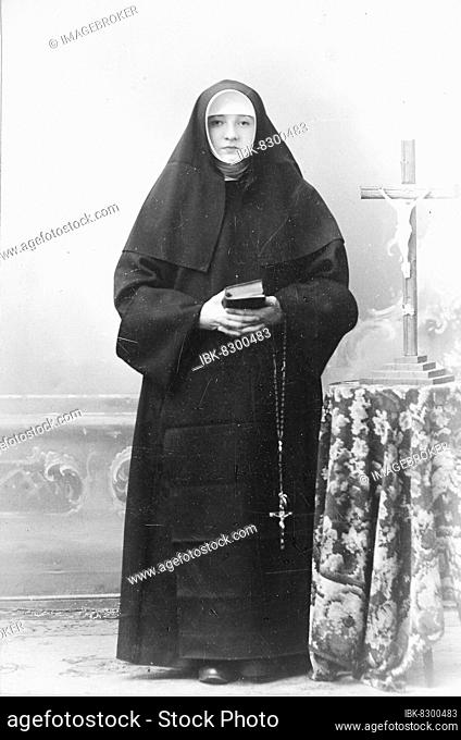 Nun with crucifix, rosary and prayer book, 1890, France, Historic, digitally restored reproduction of a 19th century original, original date unknown, Europe