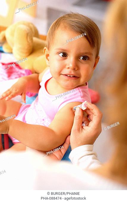 19 months old baby receiving vaccination