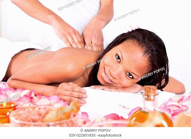 Woman Receiving Massage At Spa