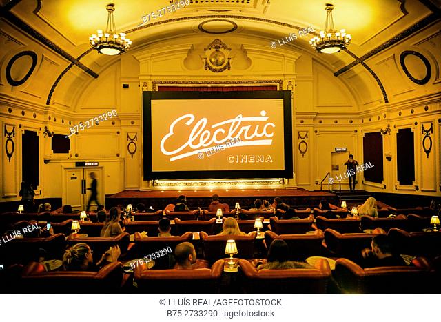 Interior of Electric Cinema with people sitting in armchairs, Portobello Rd. London, England