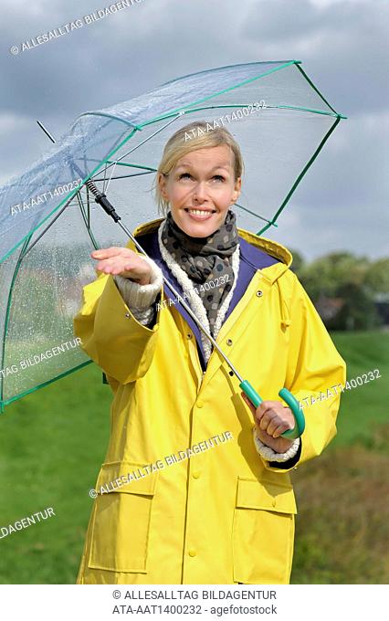 Woman walking in the rain with an umbrella