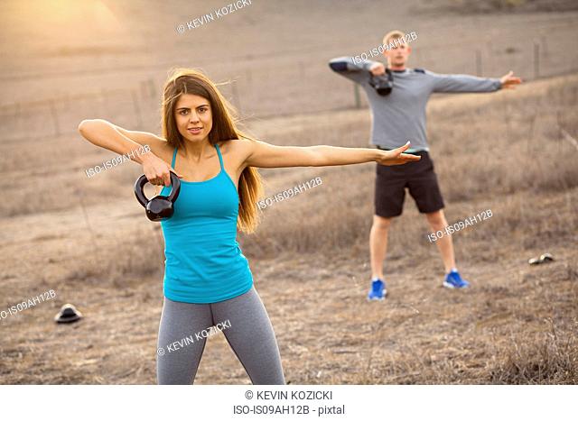 Couple working out with weights