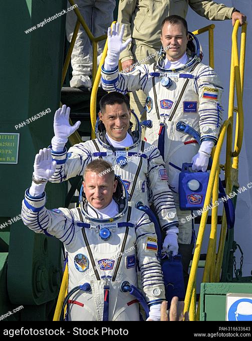 Expedition 68 crew members Dmitri Petelin of Roscosmos, top, Frank Rubio of NASA, and Sergey Prokopyev of Roscosmos, bottom
