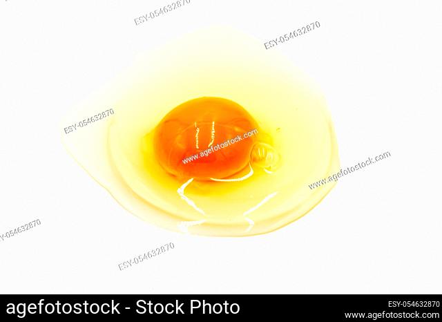 Egg yolk and white on white background