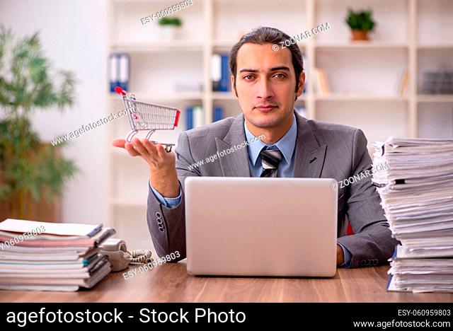 Young businessman employee in e-commerce concept