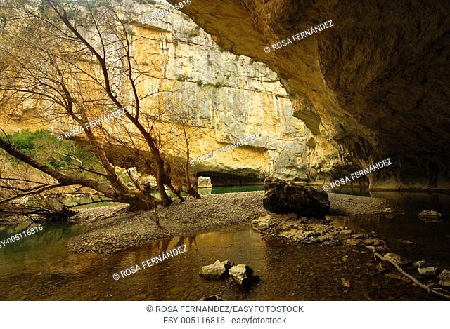 Cave in a limestone cliff close to Irati river, Foz of Lumbier, Navarra, Spain